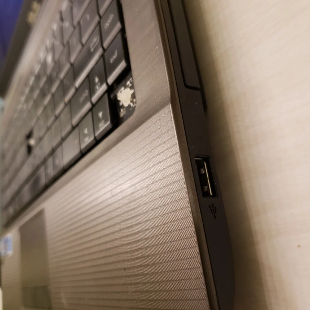 ASUS Silver Laptop with Black Keyboard WORKING